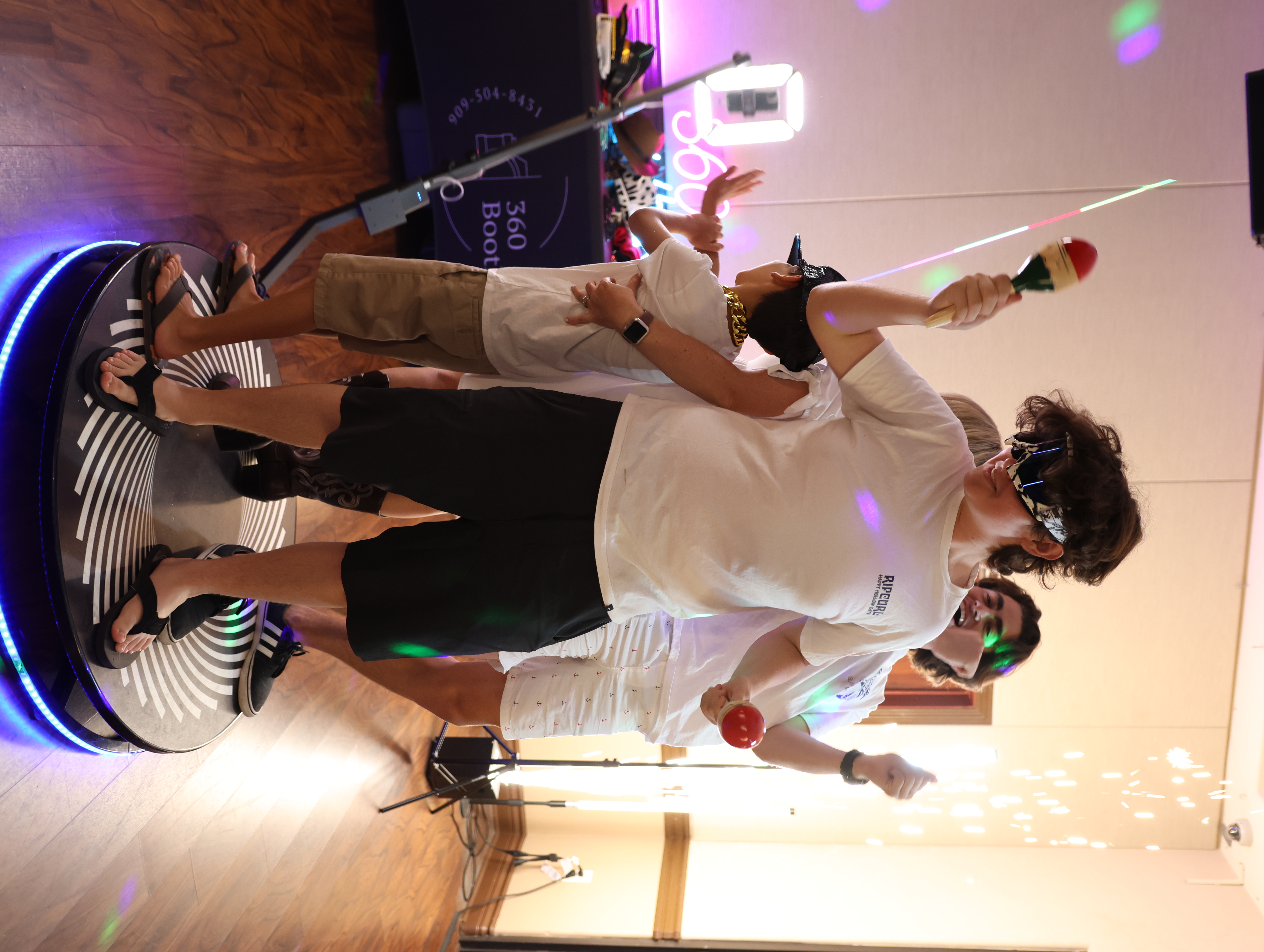 Guests interacting with a photo booth featuring social media integration